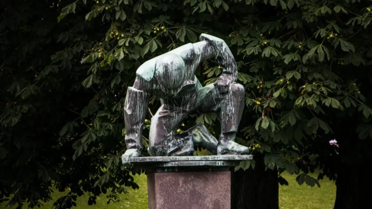 a sculpture of tired man